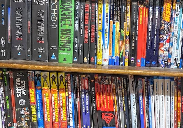 Two shelves of graphic novels.